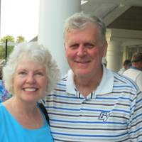 Man and woman posing for picture